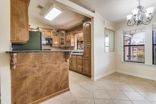 kitchen featuring pendant lighting, black appliances, light tile patterned floors, kitchen peninsula, and crown molding