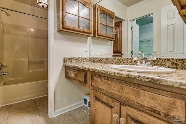 bathroom with ornamental molding, bathtub / shower combination, tile patterned flooring, and vanity