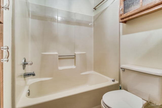 bathroom featuring toilet and shower / bath combination