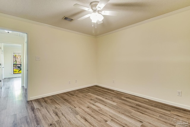 unfurnished room with ornamental molding, a textured ceiling, ceiling fan, and light hardwood / wood-style flooring