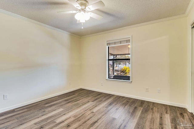 empty room featuring ceiling fan, crown molding, wood-type flooring, and a textured ceiling