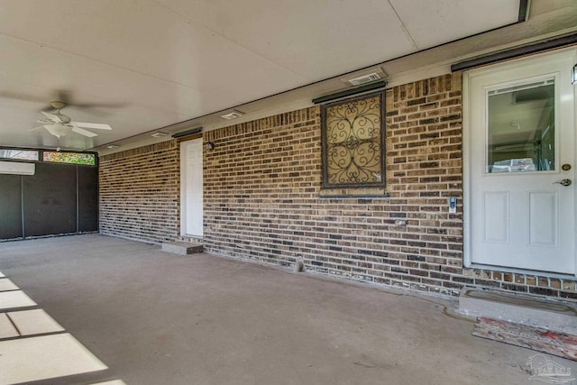 view of patio with ceiling fan and a wall mounted air conditioner