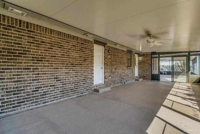 view of patio featuring ceiling fan