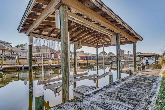 dock area featuring a water view