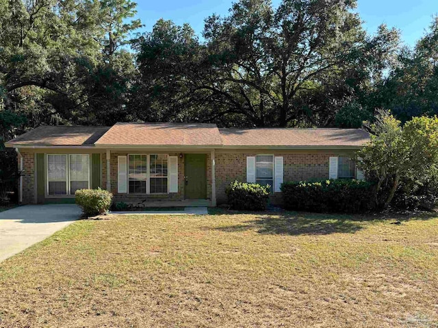 ranch-style home with a front yard