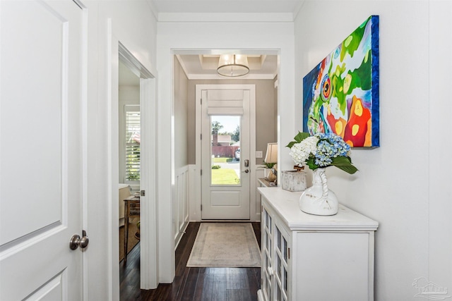 doorway to outside featuring ornamental molding and dark hardwood / wood-style flooring