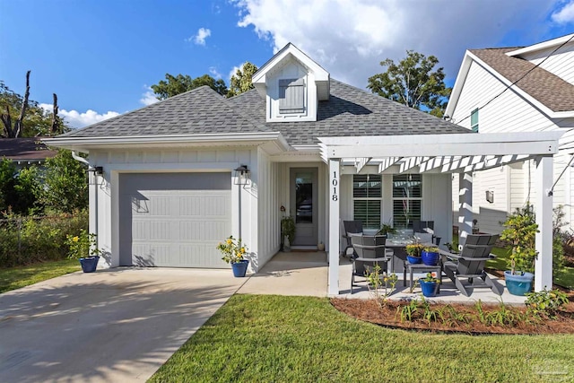 view of front of house featuring a garage, a front lawn, and a pergola