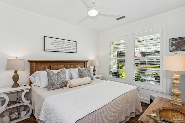 bedroom featuring ornamental molding and ceiling fan