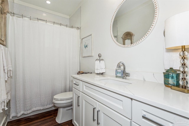 bathroom featuring vanity, toilet, wood-type flooring, and walk in shower