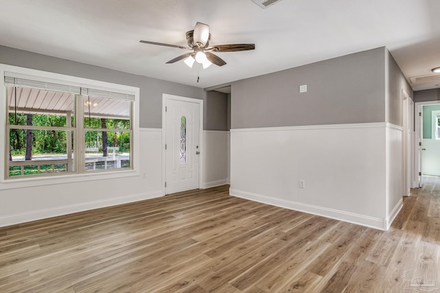 empty room featuring light hardwood / wood-style floors and ceiling fan