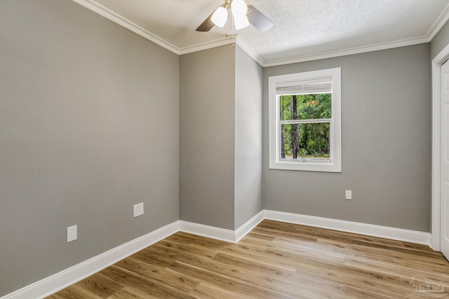 unfurnished room featuring light hardwood / wood-style floors, ornamental molding, a textured ceiling, and ceiling fan