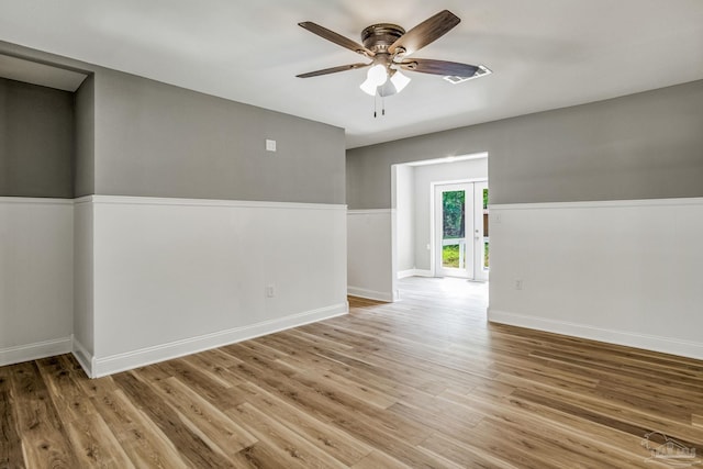 unfurnished room featuring ceiling fan and light hardwood / wood-style floors