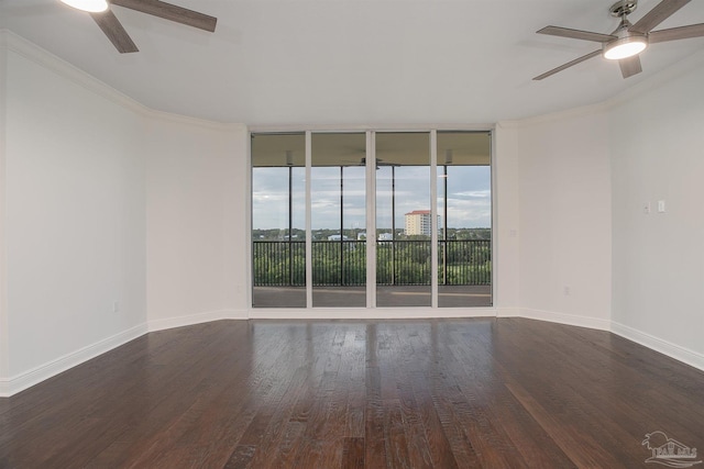 unfurnished room featuring ceiling fan, ornamental molding, floor to ceiling windows, and dark hardwood / wood-style floors