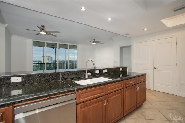 kitchen featuring sink, crown molding, light tile patterned floors, dishwasher, and ceiling fan