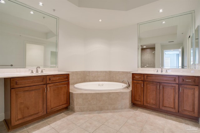 bathroom featuring tile patterned floors, vanity, and plus walk in shower