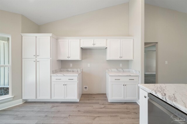 kitchen featuring white cabinets, light hardwood / wood-style floors, dishwasher, and lofted ceiling