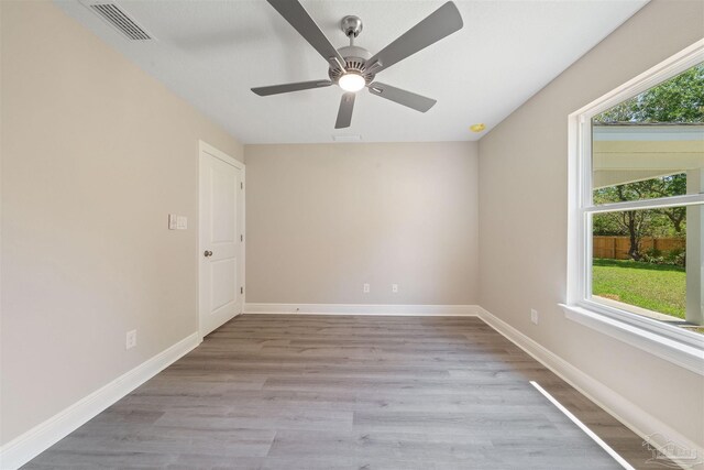 4485 Edgewood Dr, Milton, FL 32583 - spare room featuring light wood-style flooring, ceiling fan, and baseboards