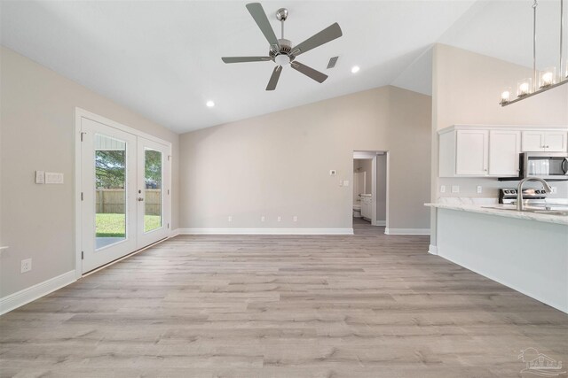 4485 Edgewood Dr, Milton, FL 32583 - unfurnished living room featuring light wood-type flooring, a ceiling fan, high vaulted ceiling, baseboards, and recessed lighting