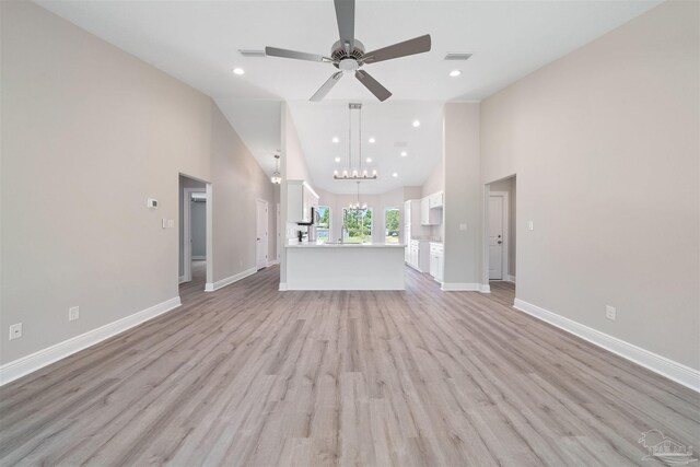 4485 Edgewood Dr, Milton, FL 32583 - unfurnished living room featuring ceiling fan, high vaulted ceiling, light wood-style flooring, recessed lighting, and baseboards