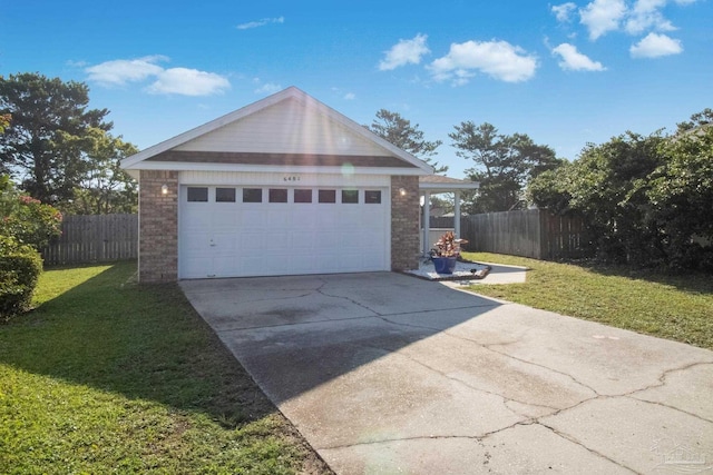 garage featuring a lawn