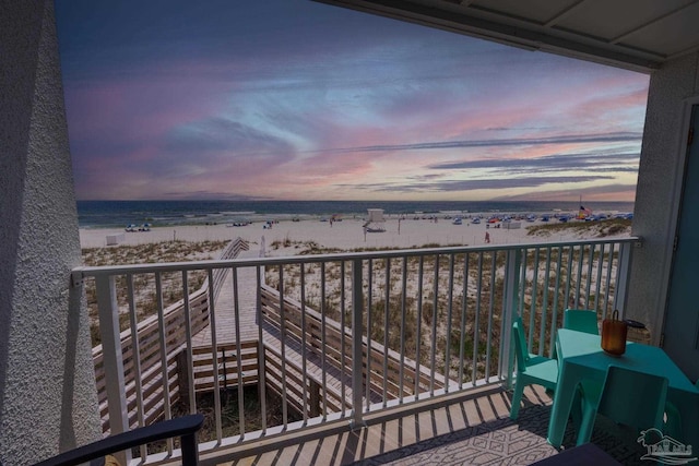 14259 Perdido Key Dr Unit 1C, Pensacola, FL 32507 - balcony at dusk featuring a beach view and a water view