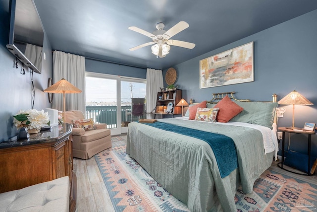 14259 Perdido Key Dr Unit 1C, Pensacola, FL 32507 - bedroom featuring ceiling fan, access to outside, and wood finished floors