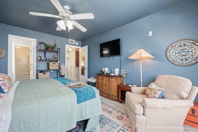 14259 Perdido Key Dr Unit 1C, Pensacola, FL 32507 - bedroom with ceiling fan, wood finished floors, visible vents, and ensuite bathroom