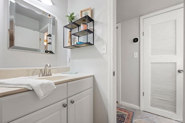 14259 Perdido Key Dr Unit 1C, Pensacola, FL 32507 - bathroom with tile patterned flooring, vanity, and baseboards