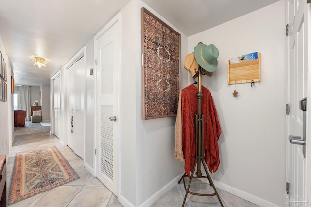 14259 Perdido Key Dr Unit 1C, Pensacola, FL 32507 - corridor with baseboards and light tile patterned flooring