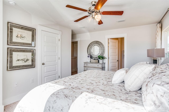 bedroom with ceiling fan and light colored carpet