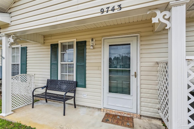 entrance to property with a porch