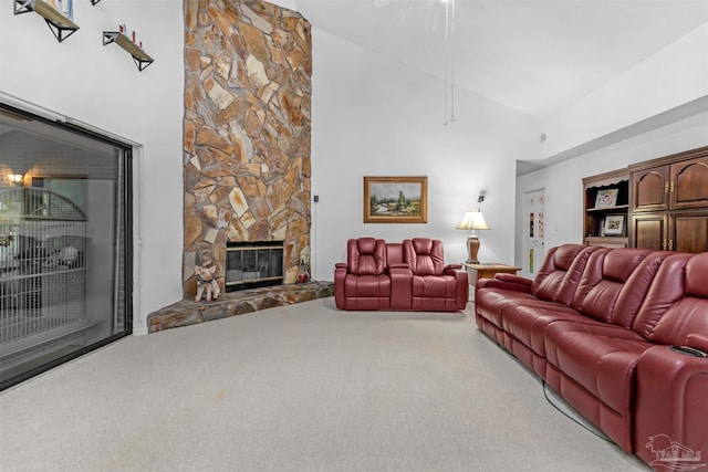 living room with high vaulted ceiling, carpet floors, and a fireplace