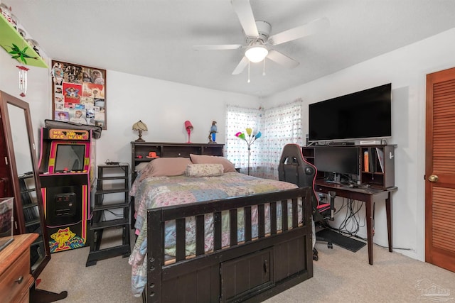 carpeted bedroom featuring ceiling fan