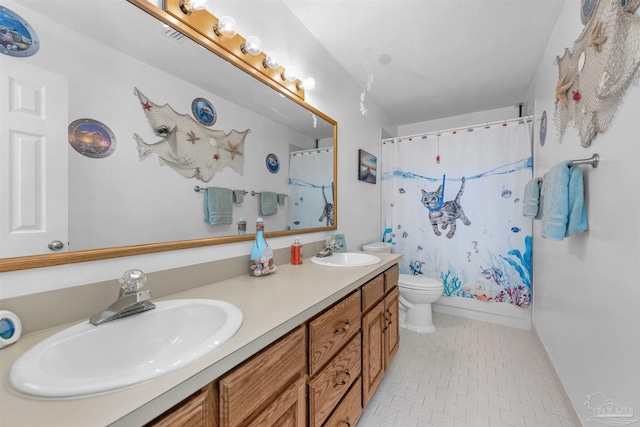 bathroom with vanity, toilet, tile patterned floors, and curtained shower