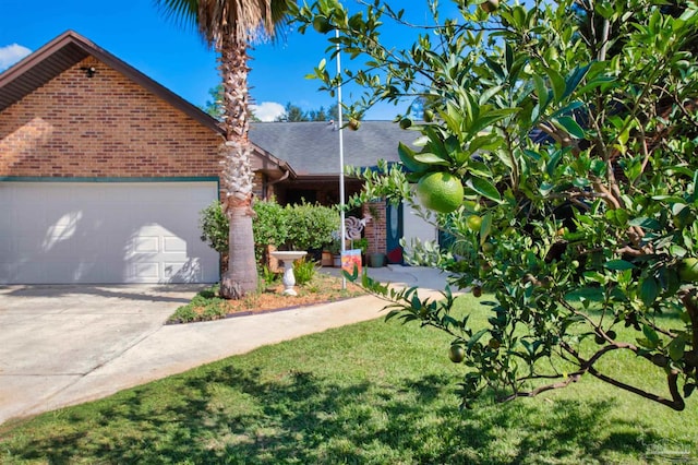 view of front of house featuring a garage and a front lawn