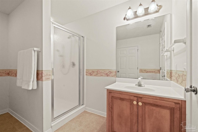 bathroom featuring a textured ceiling, tile patterned flooring, vanity, and an enclosed shower