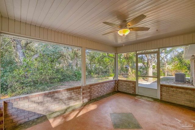 unfurnished sunroom with plenty of natural light, ceiling fan, and wood ceiling