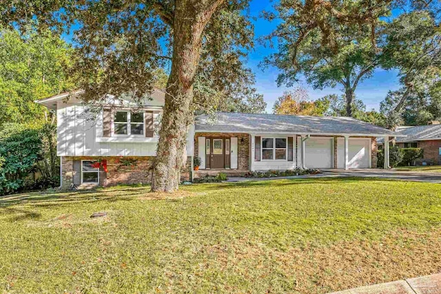 view of front of home with a front yard and a garage