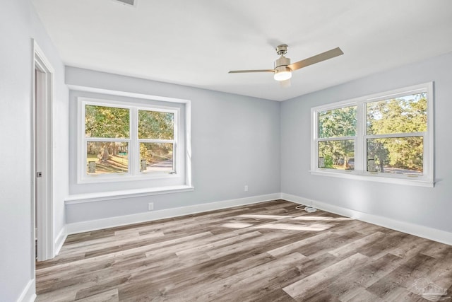 unfurnished room featuring ceiling fan and light hardwood / wood-style floors