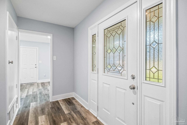 foyer with dark hardwood / wood-style floors