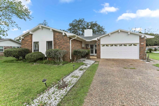 ranch-style home featuring a garage and a front yard