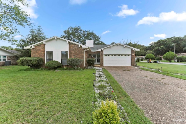 ranch-style home with a garage and a front lawn