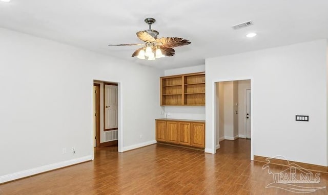 interior space with hardwood / wood-style floors and ceiling fan