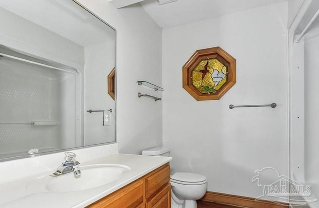 bathroom with vanity and toilet