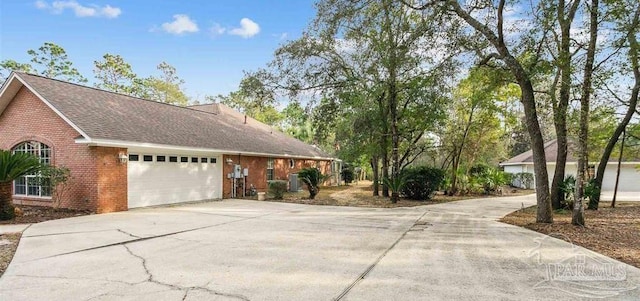 view of side of property with a garage