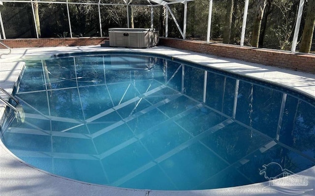 view of pool featuring a hot tub