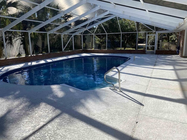 view of pool featuring a lanai and a patio