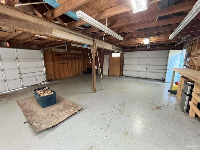 garage with stainless steel fridge