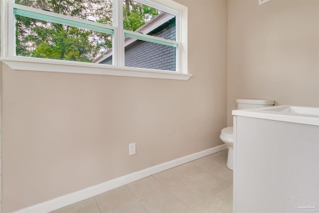 2511 Green Village Rd, Walnut Hill, FL 32568 - half bath featuring tile patterned floors, a healthy amount of sunlight, toilet, and baseboards