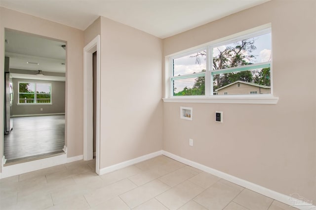 2511 Green Village Rd, Walnut Hill, FL 32568 - washroom featuring hookup for a washing machine, light tile patterned flooring, baseboards, and hookup for an electric dryer